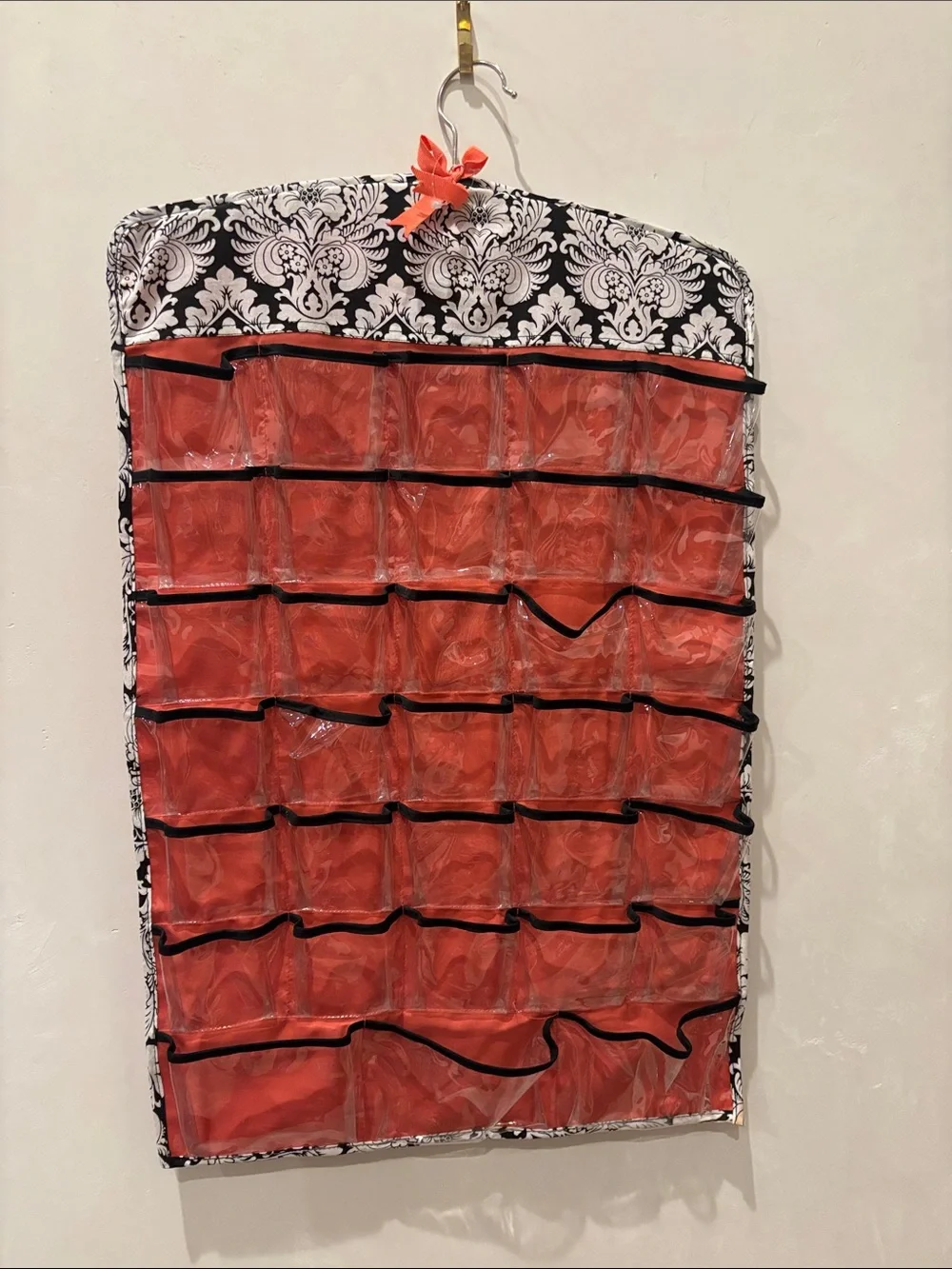 Charming Charlie 66-Pocket Hanging Organizer in Red and Black
